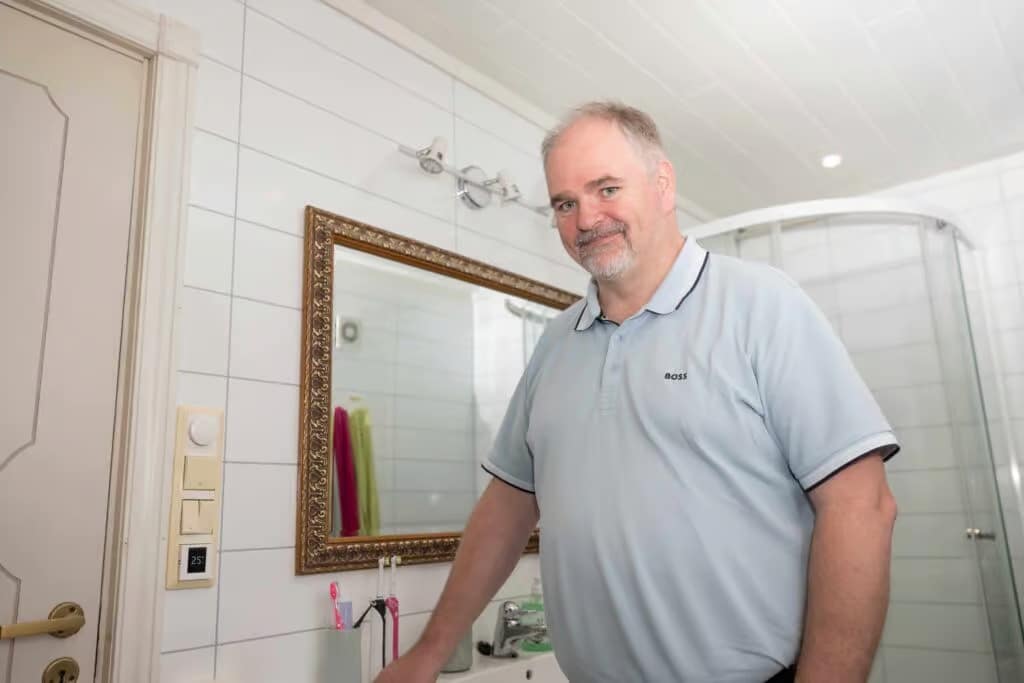 a man standing in a bathroom