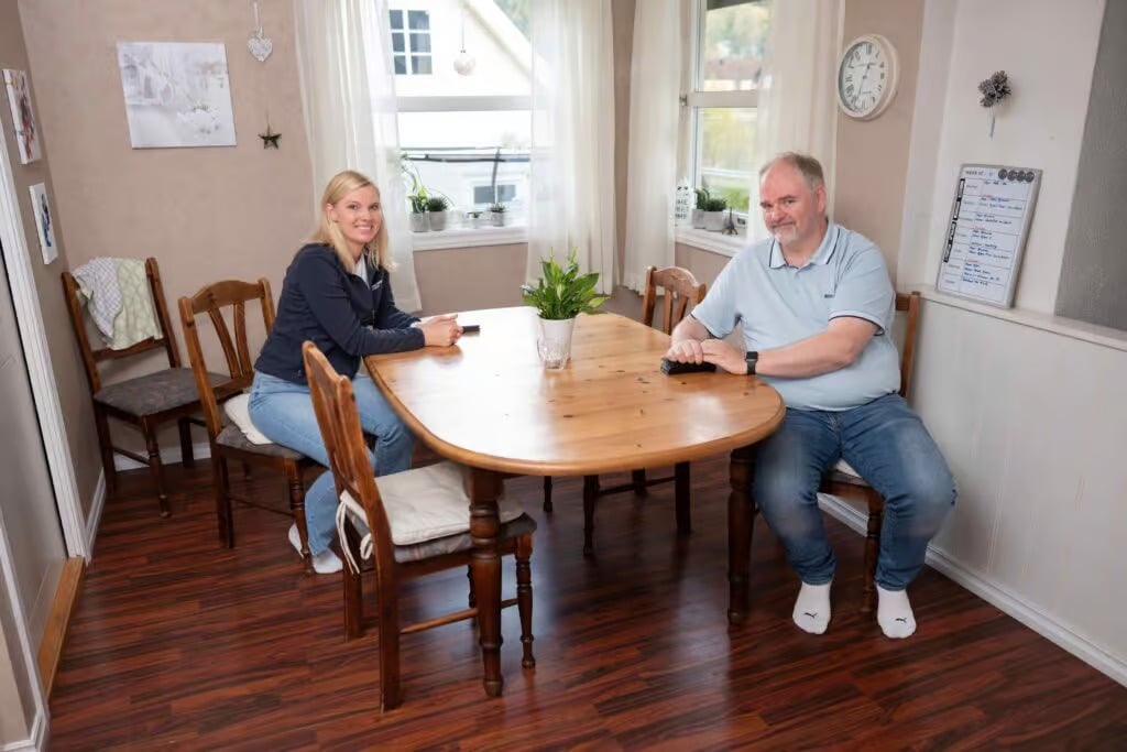 a man and woman sitting at a table