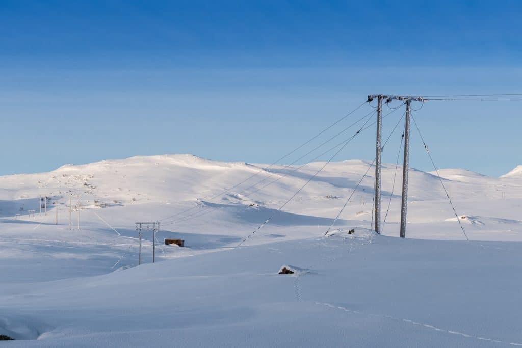 power lines in a snowy landscape