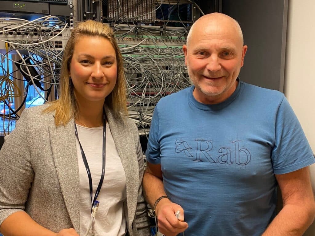 a man and woman standing next to each other